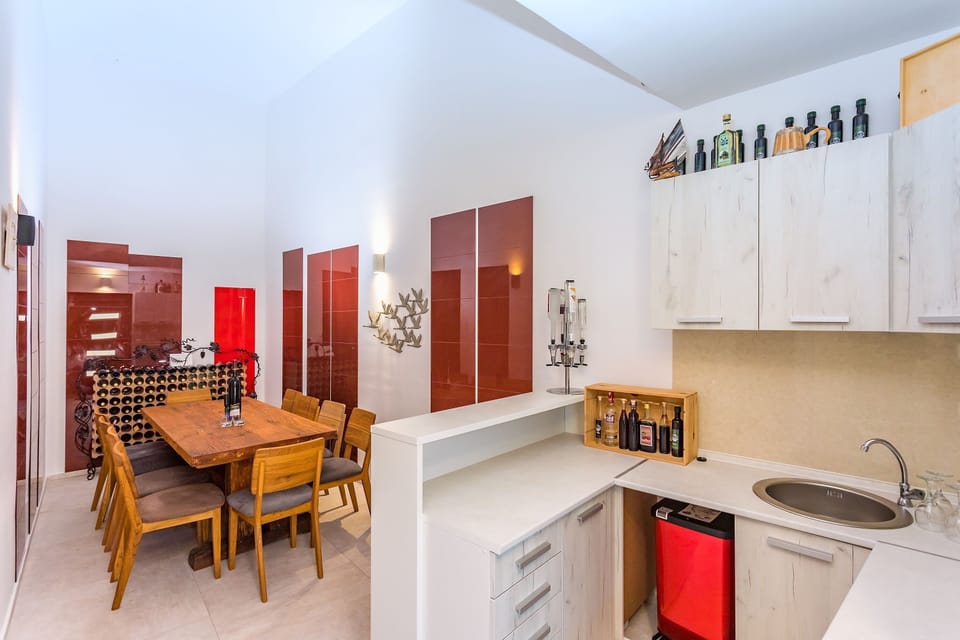 Another indoor dining area for 12 people with an electric barbecue.