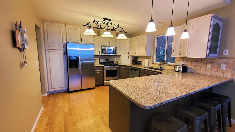 Enjoy the convenience of the fully-equipped kitchen with gas range & coffee bar