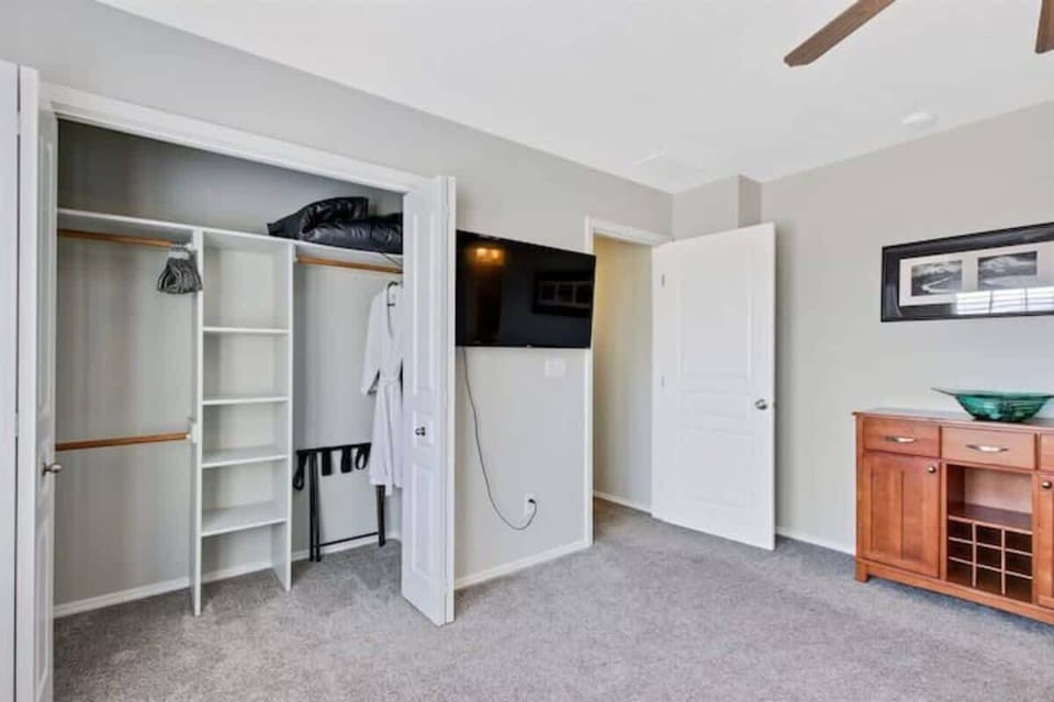 Master bedroom closet and TV. There is more closet space off the master bathroom.