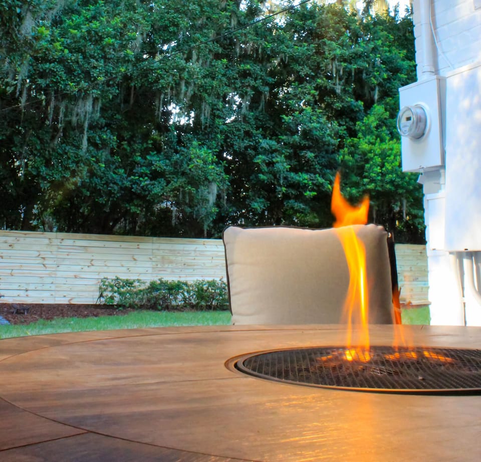 Find your oasis in the spacious backyard with a hot tub and two firepits.