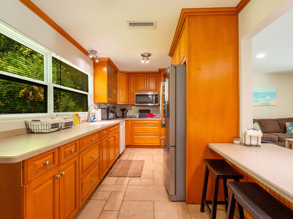 Kitchen with dishwasher, fridge, stove, oven, microwave