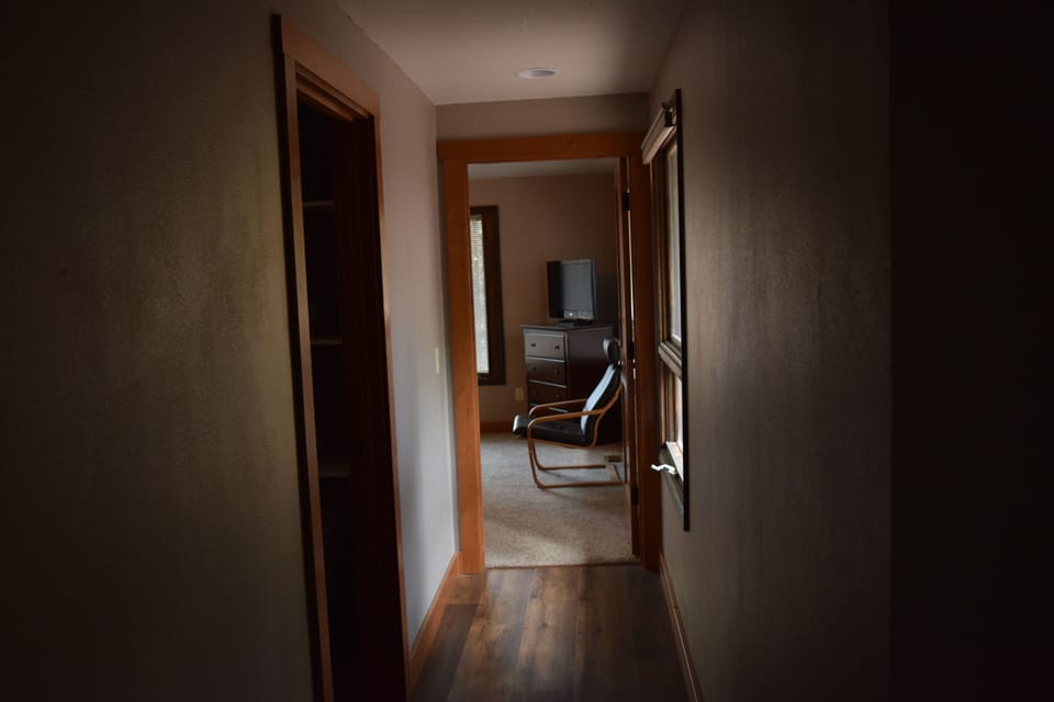 View down the hallway to third bedroom