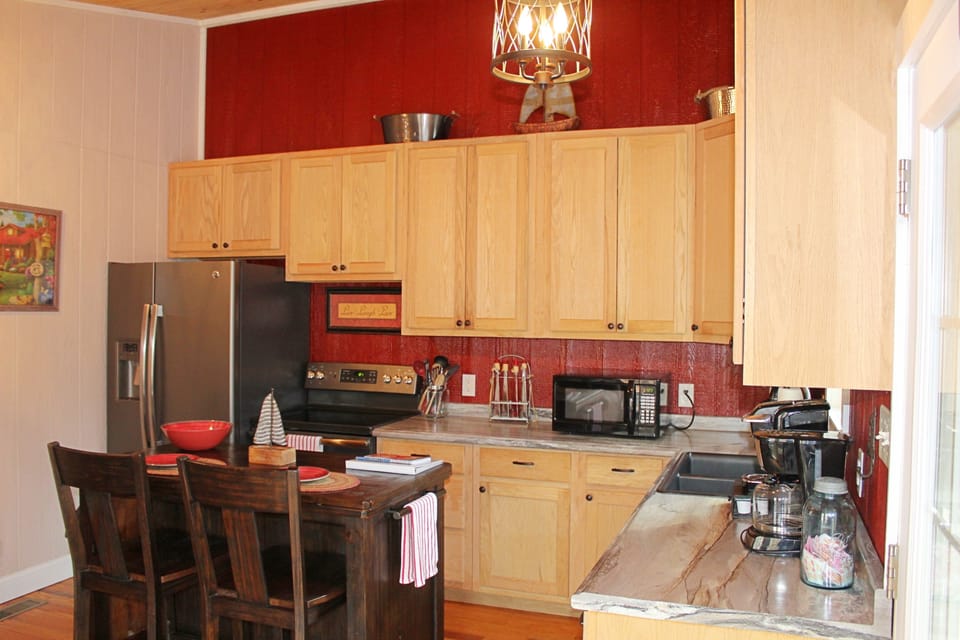 Fully stocked, eat-in kitchen. 