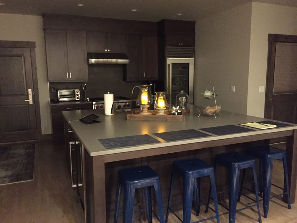 Large caesarstone island with seating for four.