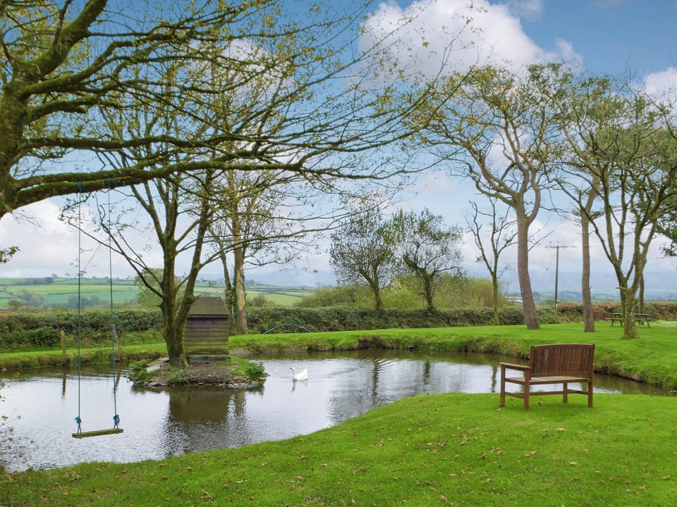 Garden area with pond | Bluebell Cottage - Penfeidr Cottages, Glanrhyd, near Newport