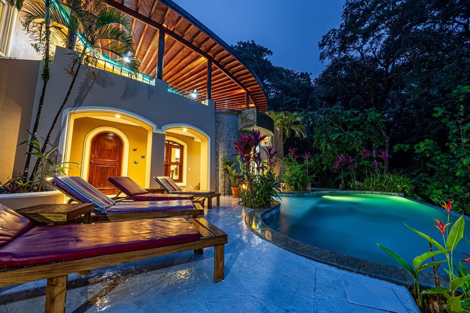 Pool area beautifully lit at night for a magical atmosphere
