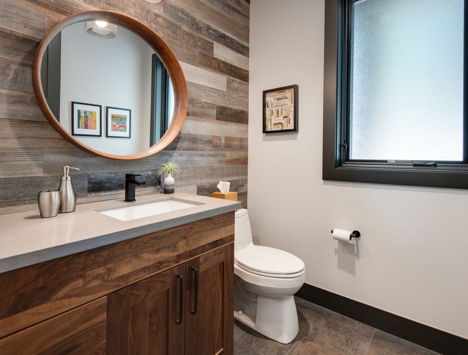 The powder room showcase more barnwood