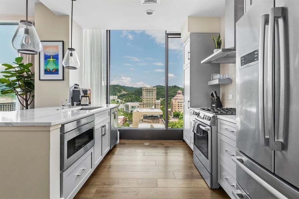 Kitchen with 5 burner gas stove, dishwasher, microwave, Keurig and refrigerator