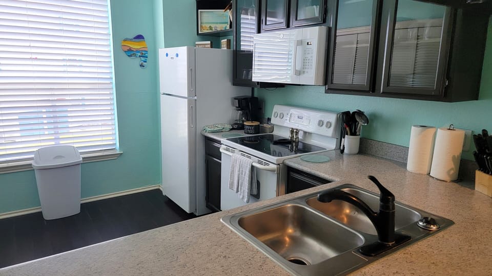 Kitchen stocked with pots, pans, & dishes