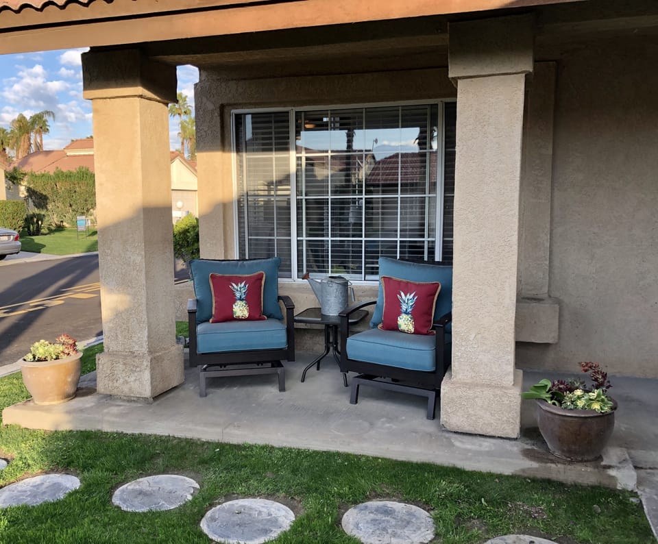 Front patio with comfortable outdoor rocking chairs 