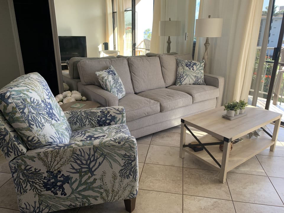 Sofa bed with a comfortable memory foam mattress and recliner chair.
