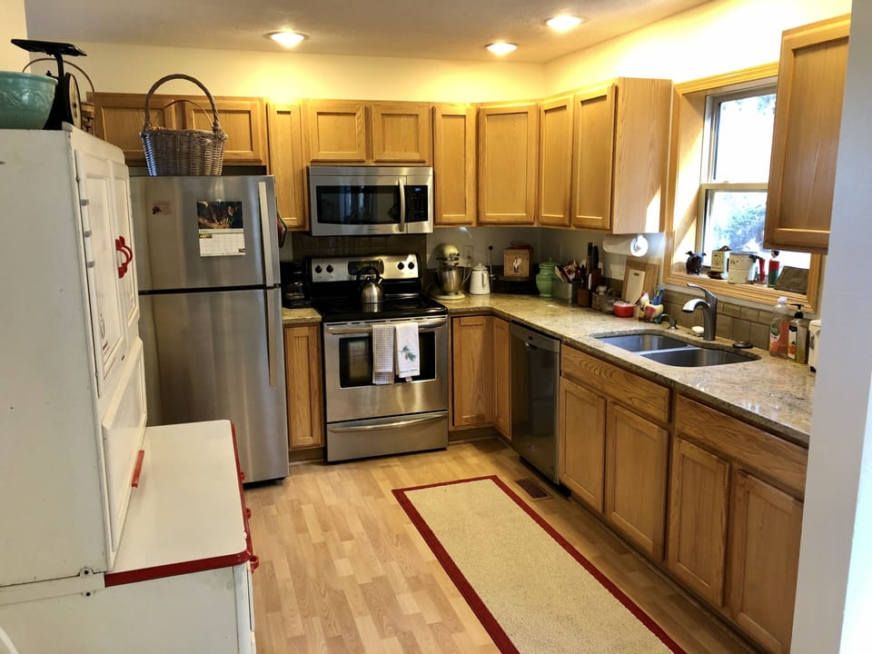 Open kitchen with all the gadgets you'll need for both cooking & baking.