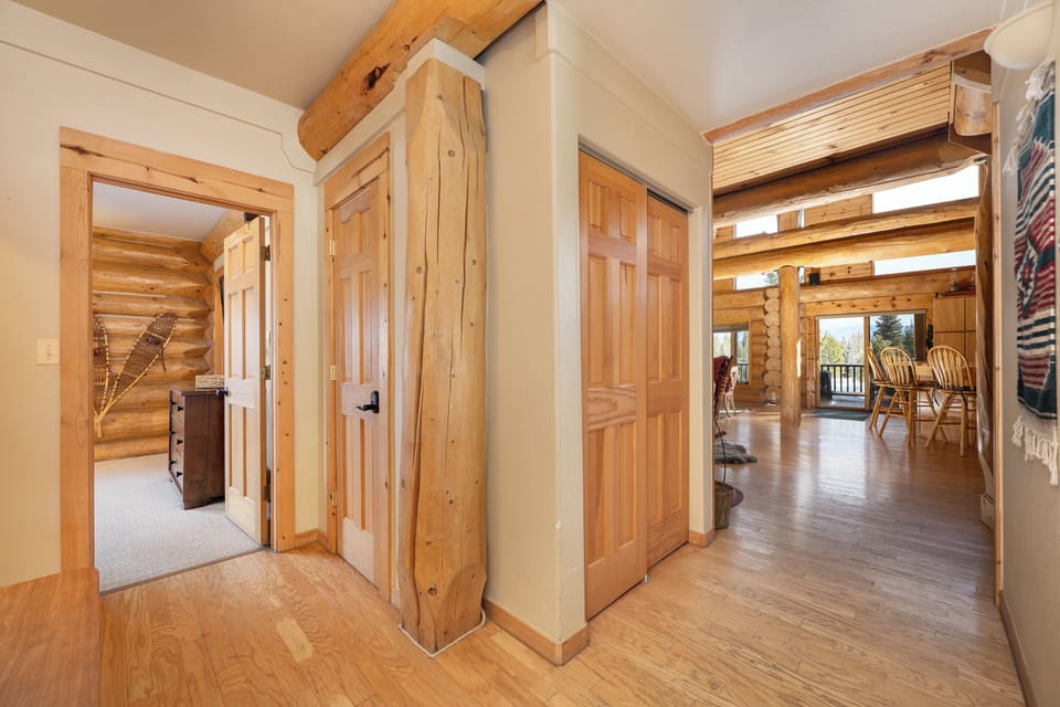 Step into your rustic mountain retreat, where warm wood beams and natural textures create an inviting atmosphere that feels like home.