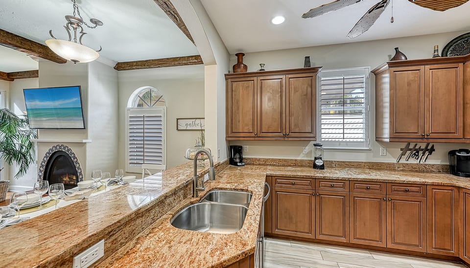 Spacious and sleek, this kitchen is fully stocked and ready for anything—from morning coffee to evening cocktails and full family meals.