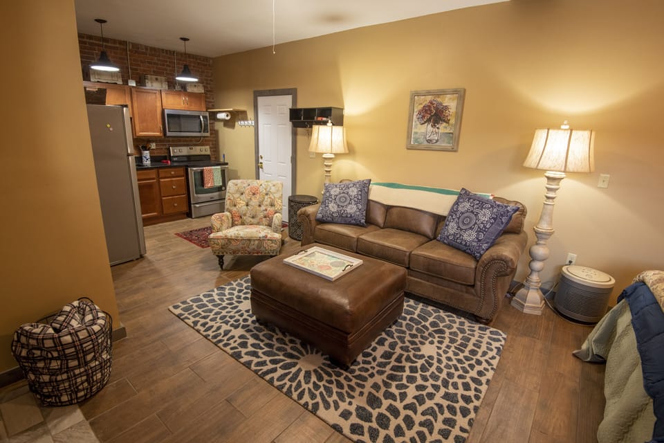 Relax in living room suite adjoining kitchen