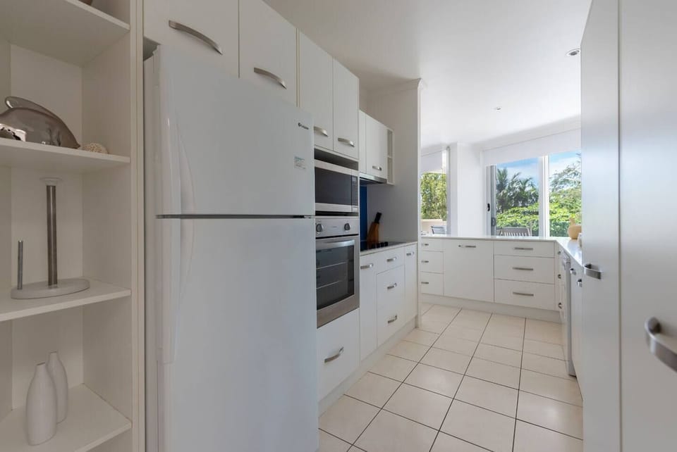 The kitchen provides ample space to store your groceries and prepare meals at home.
