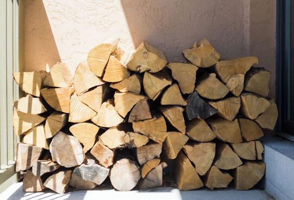 Cozy up by your fireplace with this perfectly seasoned firewood stack, ready for memorable evenings.