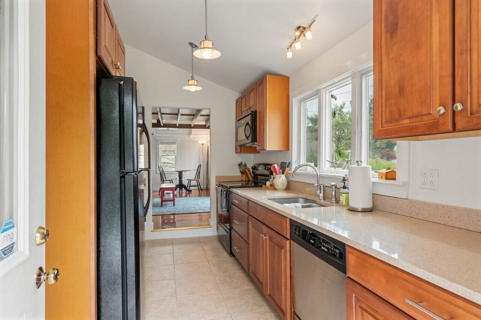 Well equipped galley style kitchen with dishwasher and garbage disposal
