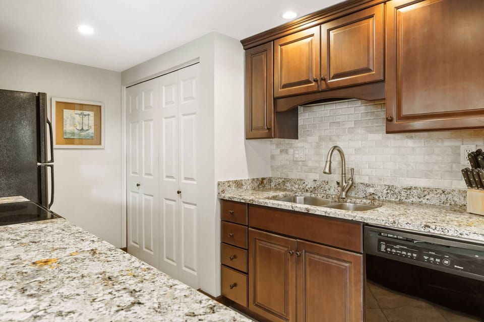 The full size washer and dryer tucked behind doors