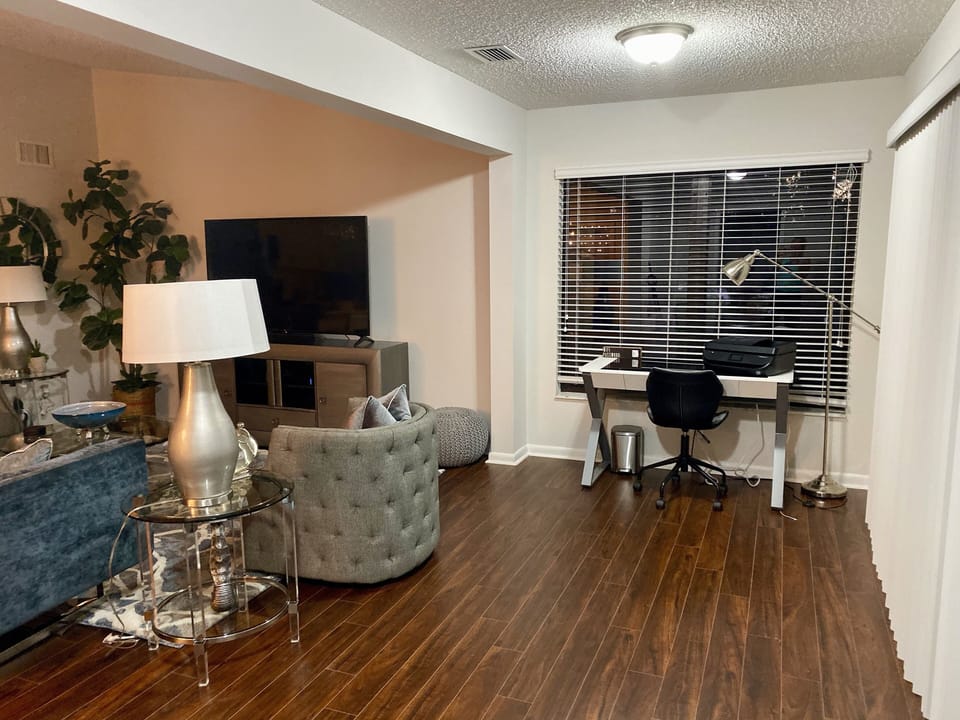 Desk with Printer. Could be moved to add a pull out to allow for more guests.