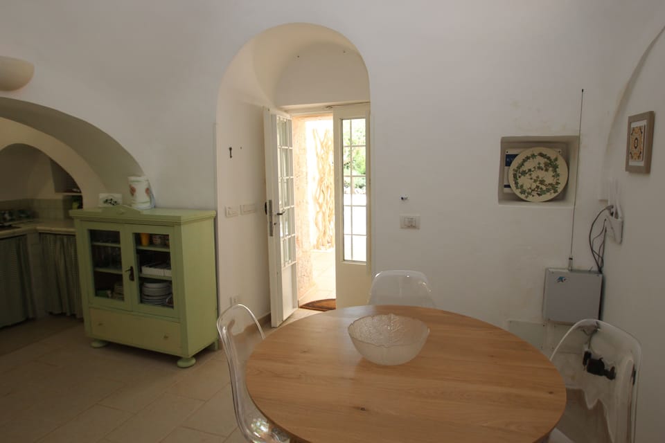 Trullo kitchenette with door to veranda