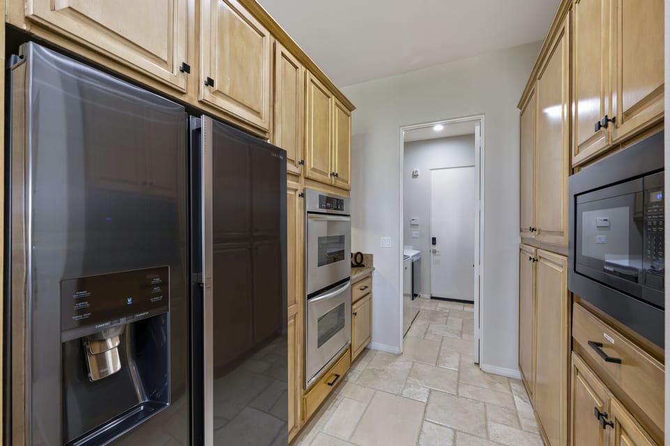 Kitchen opens to laundry room