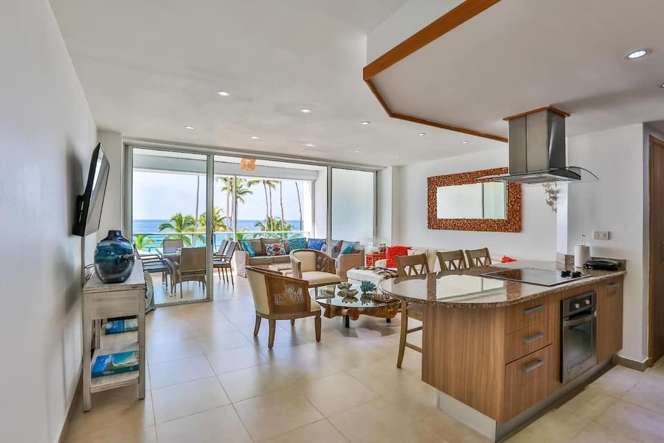 Beachfront Living Room – Relax with A/C, Smart TV, and ocean views — your cozy corner by the beach.