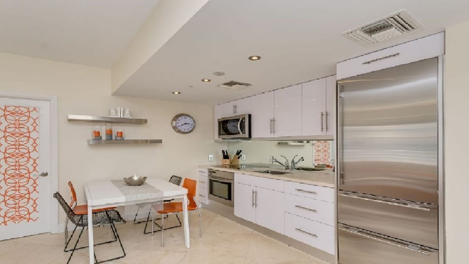 Breakfast area seats 4 comfortably, full sized stainless refrigerator