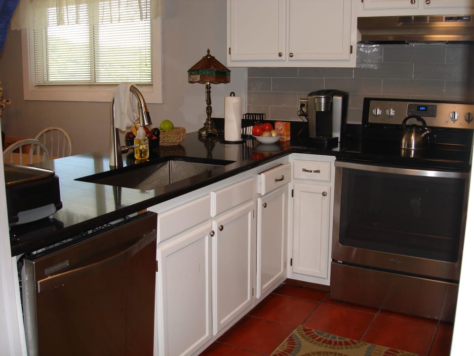 kitchen with new labyrinth quartz counter tops & stainless steel appliances