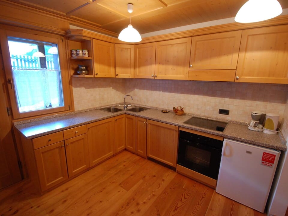 Countertop, Cabinetry, Room, Furniture, Property, Kitchen, Lighting, Floor, Hardwood, Interior Design