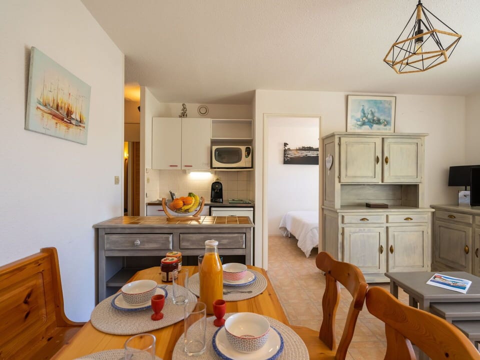 Property, Furniture, Table, Cabinetry, Orange, Interior Design, Living Room, Wood, Lighting, Home Appliance
