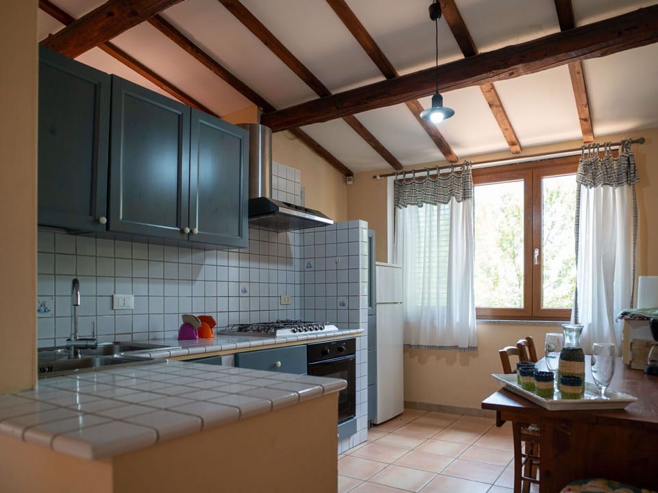 Furniture, Cabinetry, Countertop, Wood, Kitchen, Kitchen Stove, Gas Stove, Interior Design, Exhaust Hood, Table