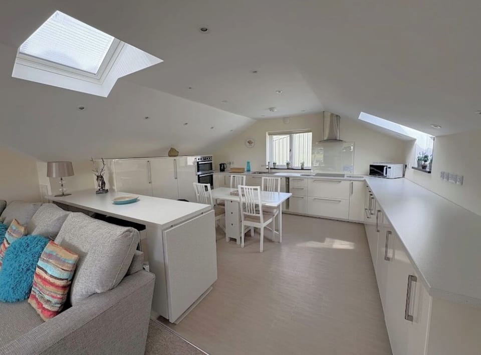 Kitchen area showing the breakfast bar and some of the sofa