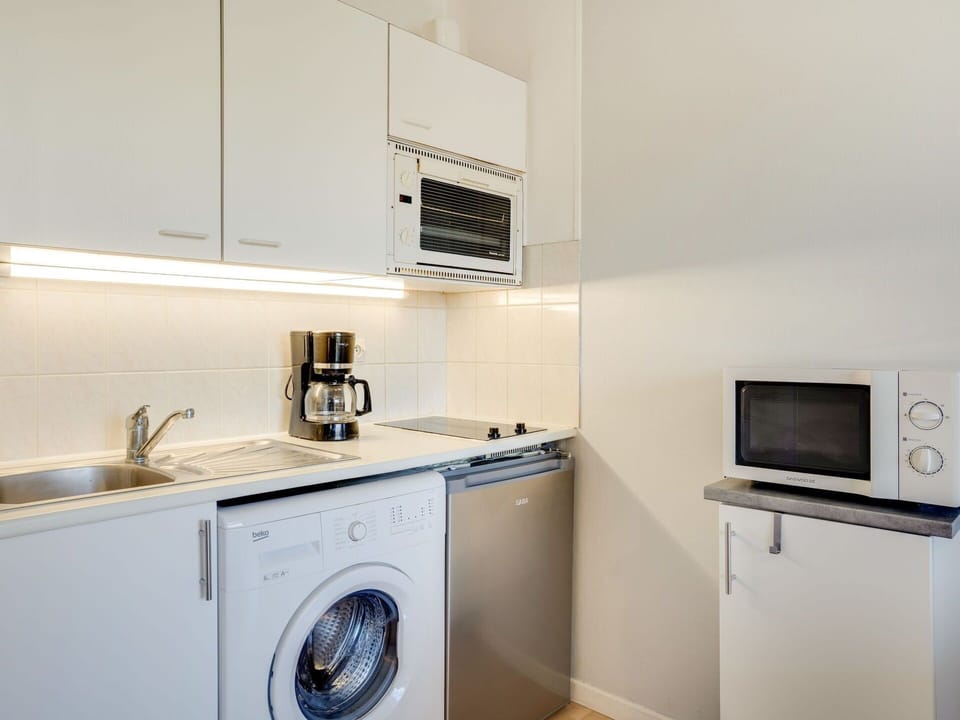 Cabinetry, Property, Kitchen Sink, Kitchen Appliance, Sink, Home Appliance, Kitchen, Clothes Dryer, Kitchen Stove, Interior Design