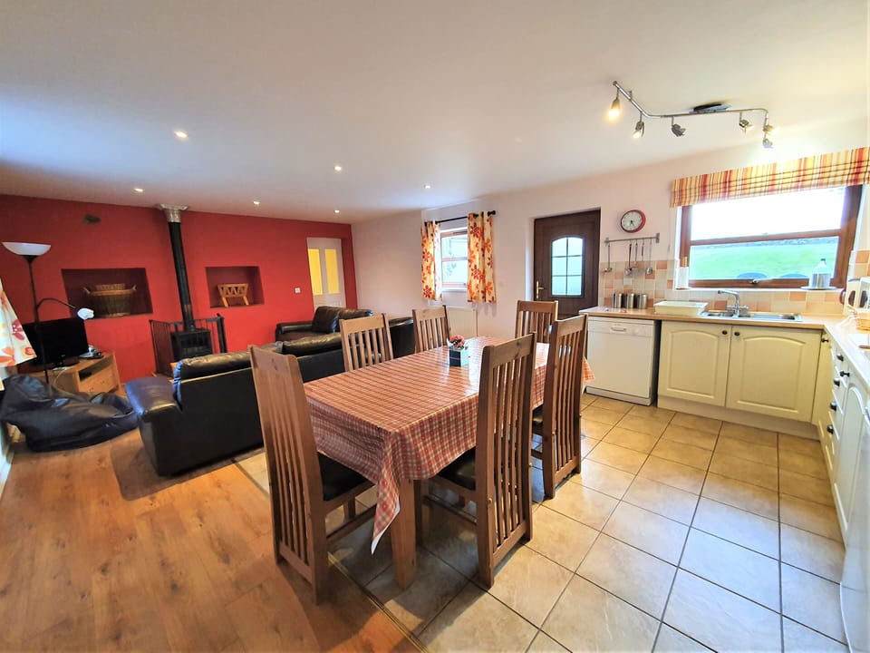 Open plan living, dining and kitchen spaces