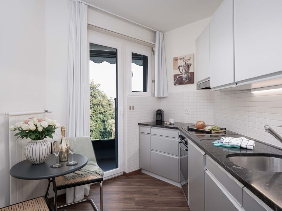 Kitchen, Countertop, Interior Design, Kitchen Appliance, Major Appliance, Furniture, Cabinetry, Ceiling, Home, Flooring
