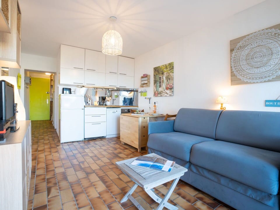 Couch, Property, Furniture, Table, Cabinetry, Picture Frame, Wood, Interior Design, Lighting, Studio Couch