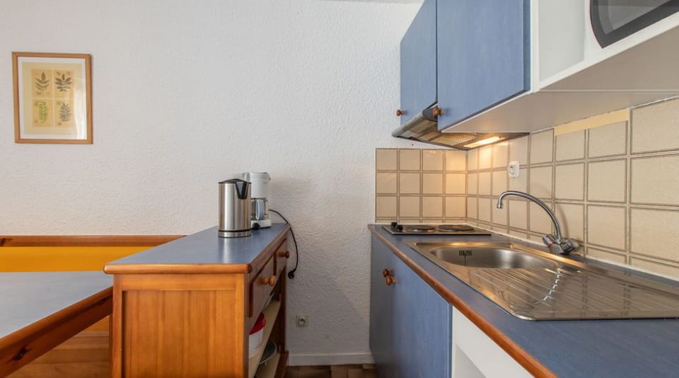 Curb your appetite by cooking a meal in your kitchen.