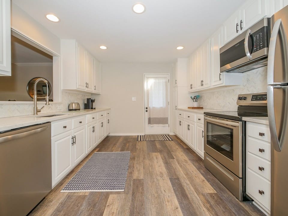 Updated Kitchen with Stainless Steel Appliances at 630 Queens Grant
