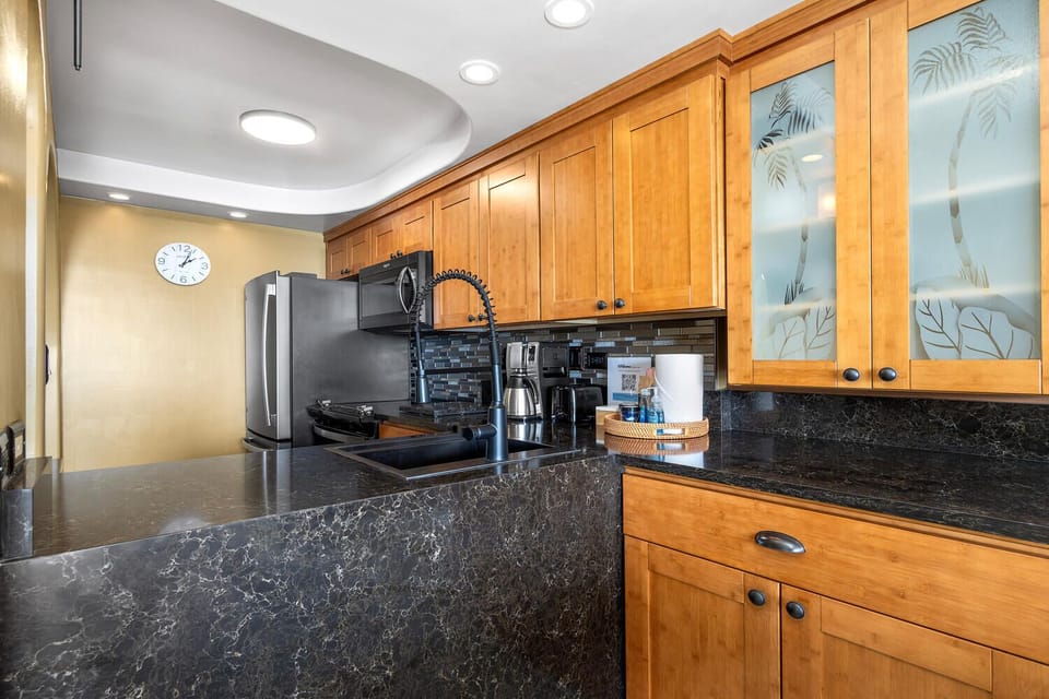 The kitchen at Kona Alii 304 is outfitted with all large appliances, a variety of small ones, as well as all culinary essentials needed to create a savory gourmet meal