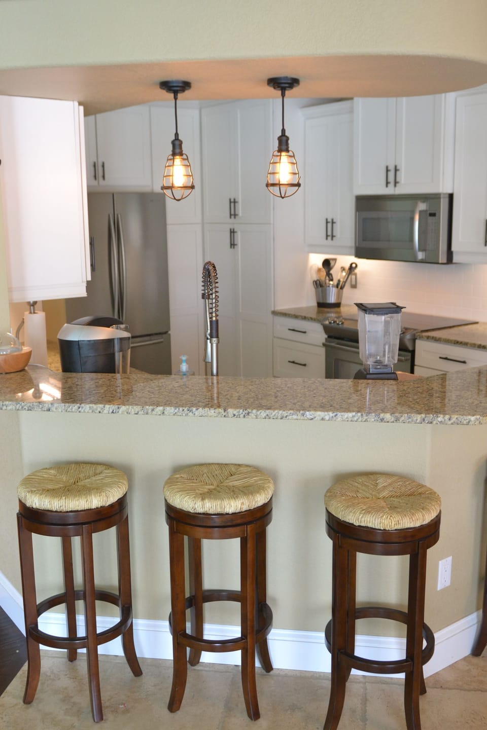 Beautiful fully-equipped kitchen with granite countertops & bar seating for 4.