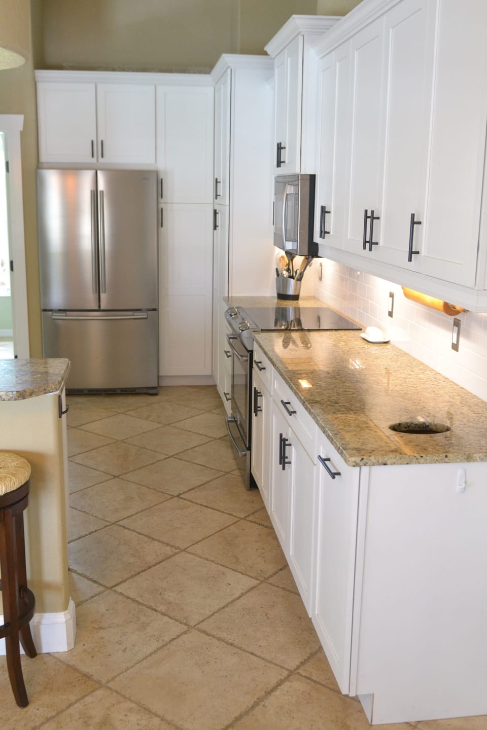 Beautiful kitchen features stainless steel appliances & granite countertops