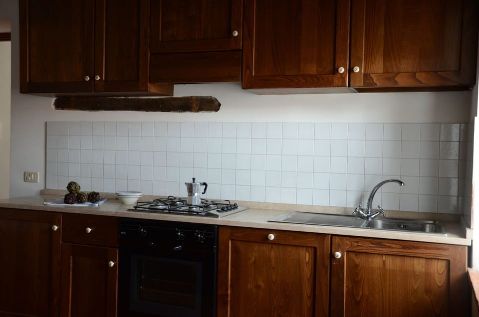 Countertop, Cabinetry, Kitchen, Room, Furniture, Property, Sink, Tile, Lighting, Wood Stain