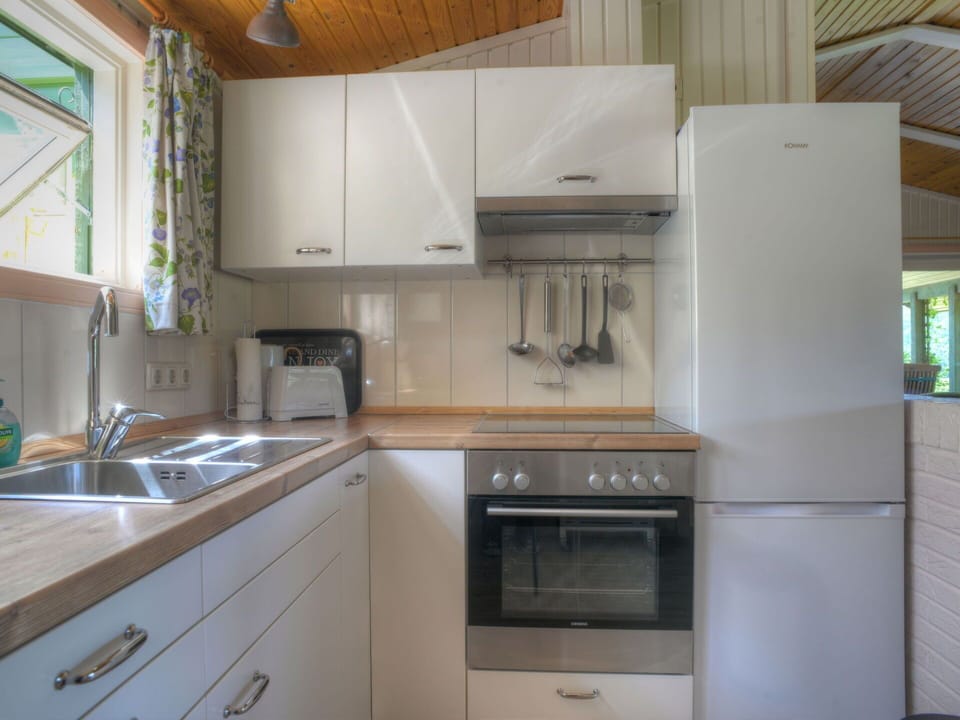 Cabinetry, Countertop, Property, Kitchen Sink, Building, Sink, Kitchen Stove, Kitchen, Kitchen Appliance, Wood
