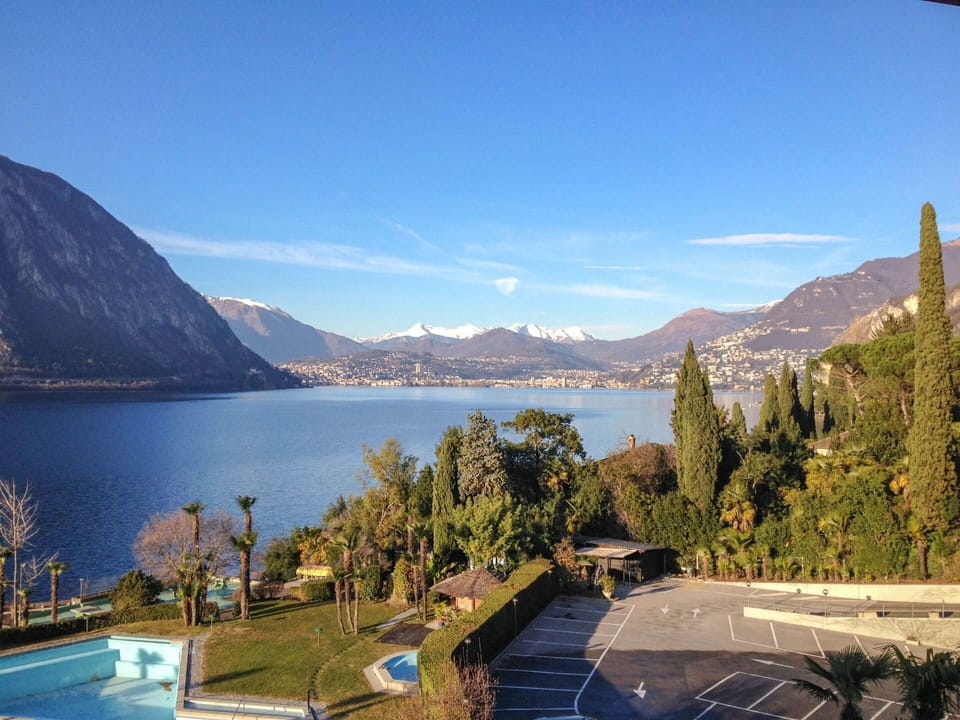 Mountain, Sky, Mountainous Landforms, Lake, Property, Water, Wilderness, Mountain Range, Real Estate, Highland
