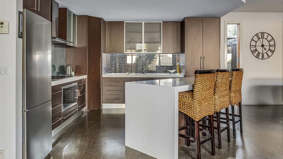 Our stylish kitchen complete with a sleek breakfast bar that's perfect for enjoying your morning coffee