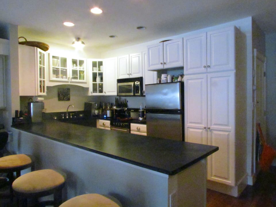 Open chefs kitchen with soapstone counters, stainless steel appliances