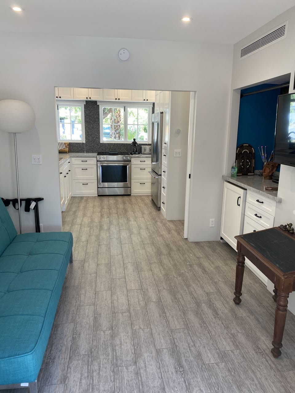 Den (blue room) w kitchen in background