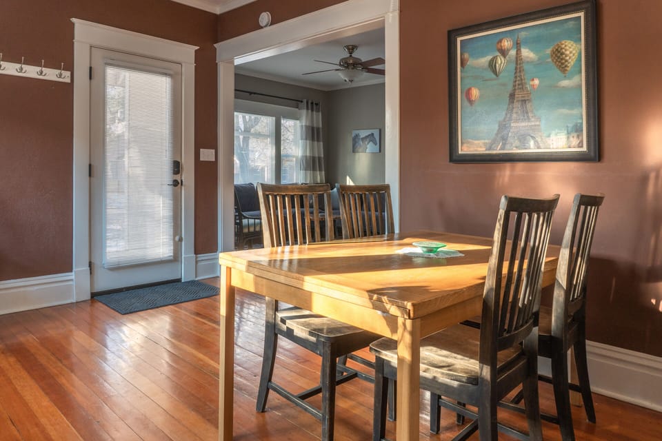 Dining room with game cabinet & gas fireplace. Table extends to seat 6.
