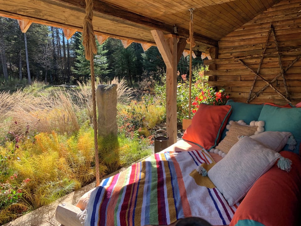 The hanging porch bed is a favorite place to unwind outdoors.